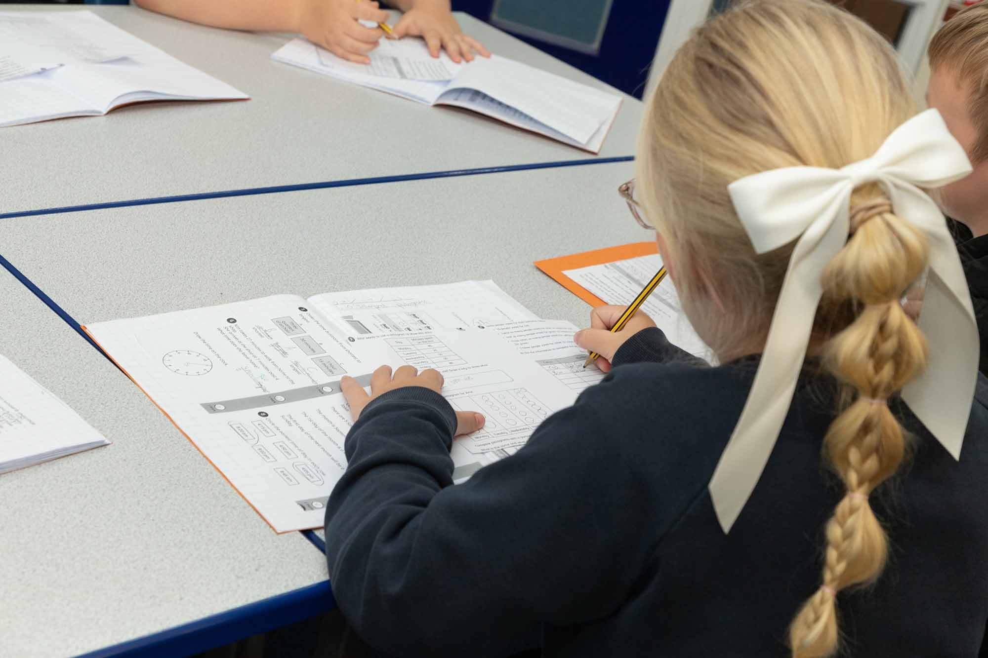 Child completing Maths test