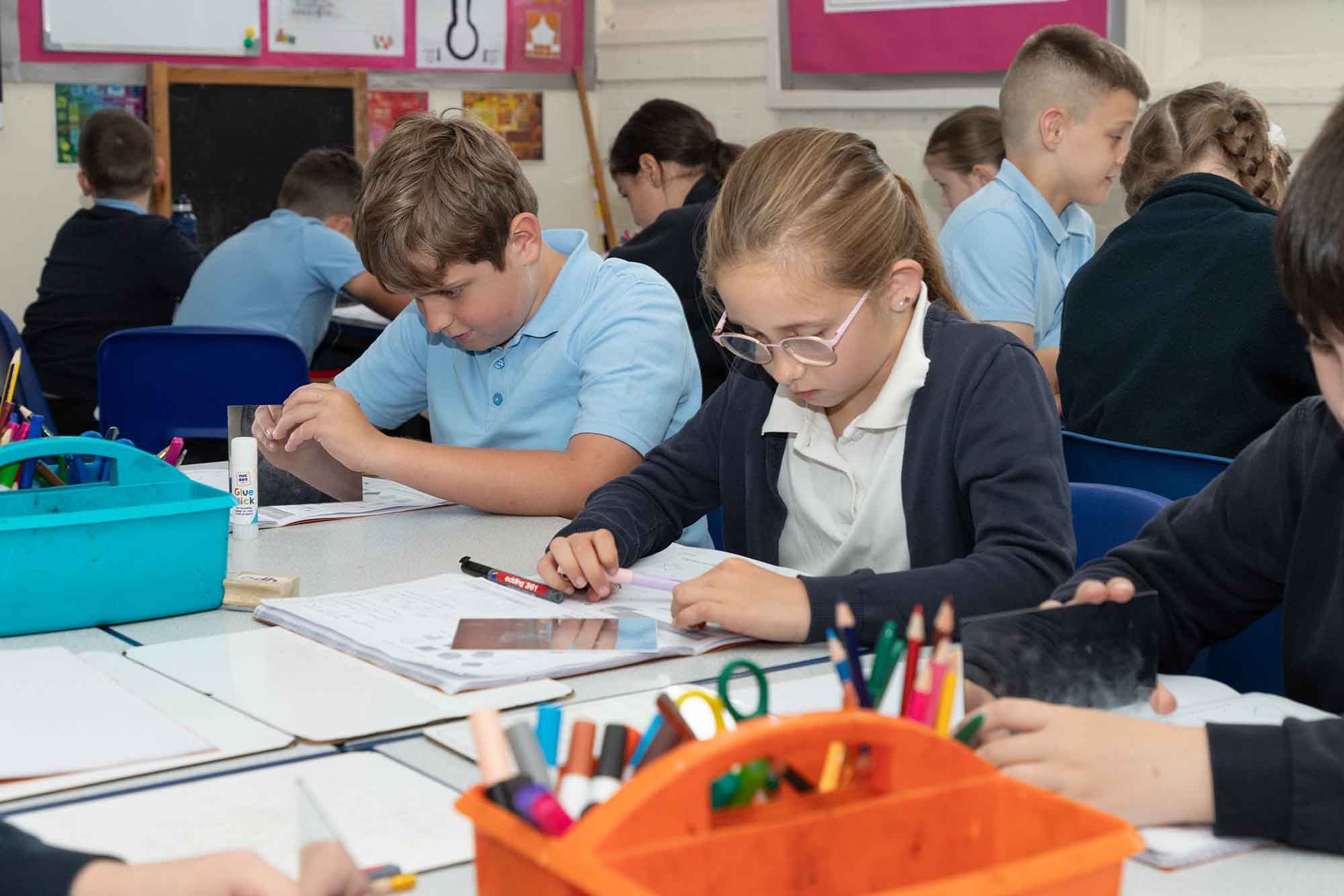 Children using mirrors on a test